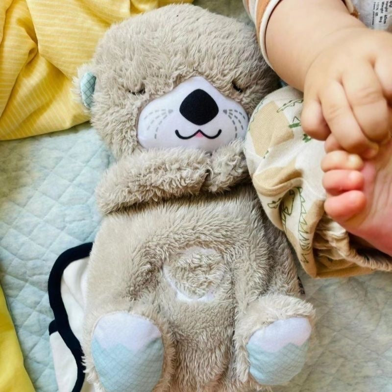 Peluche loutre apaisante et respirante avec berceuse