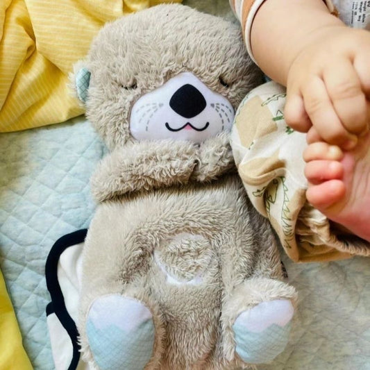 Peluche loutre apaisante et respirante avec berceuse